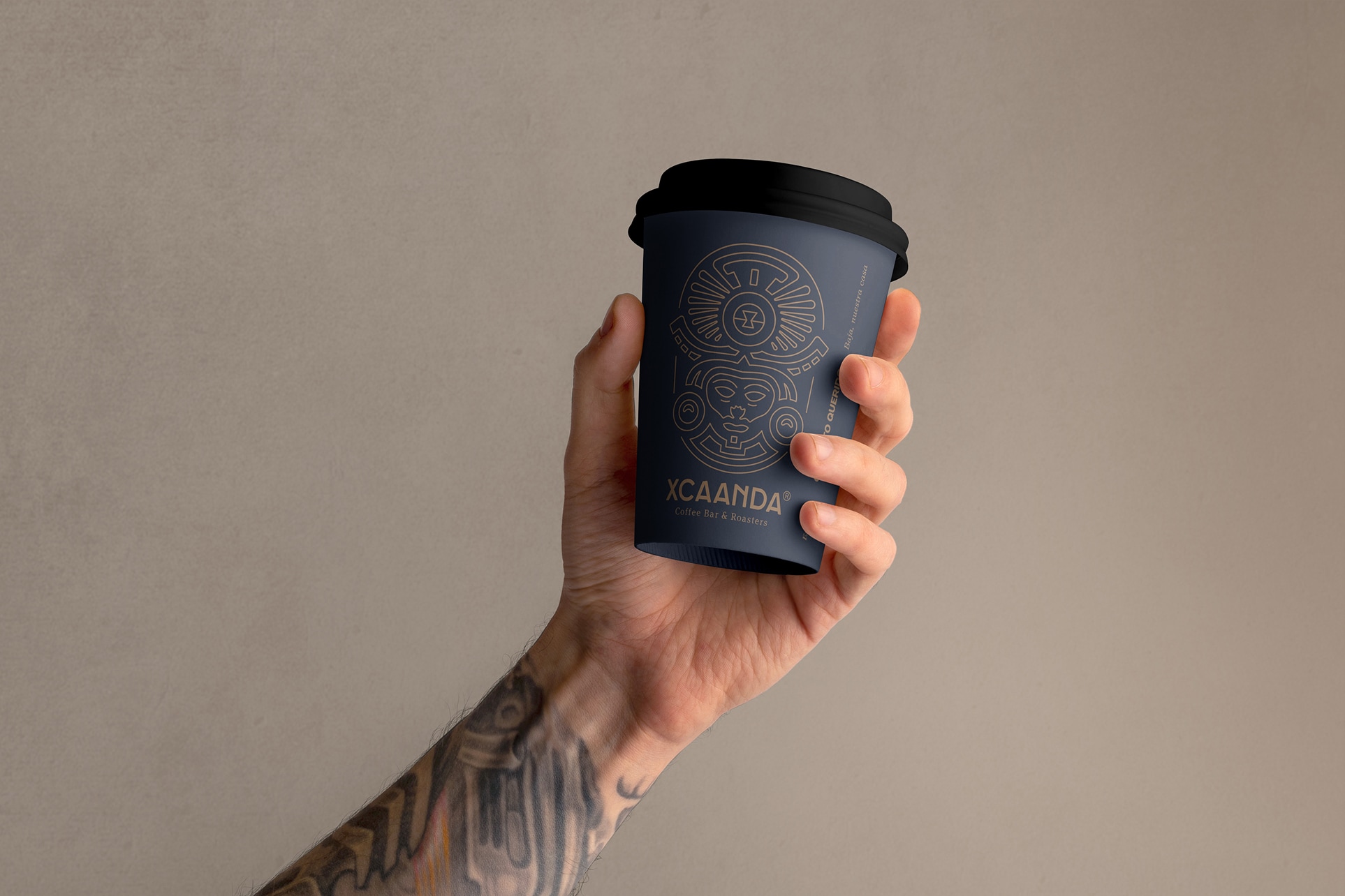 Xcaanda coffee Cup Hand holding an Xcaanda coffee cup