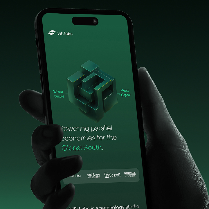 Hand holding a phone with a green brand identity on screen